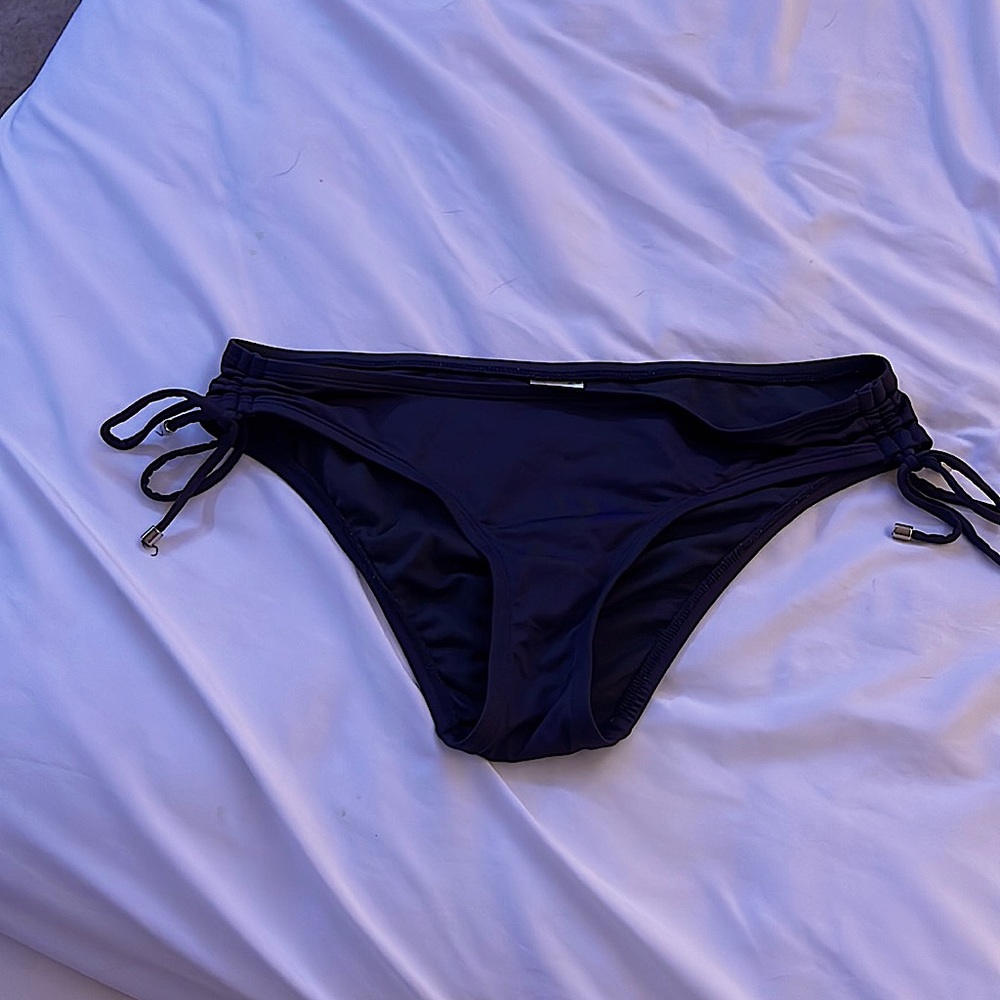 Dark grey bathing suit bottoms.